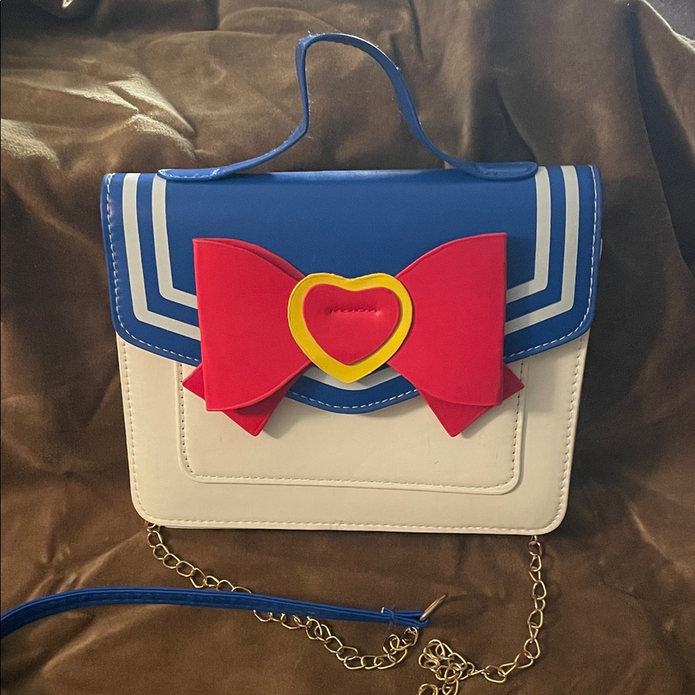 Sailor Moon front flap bag with magnetic closure and chain crossbody strap